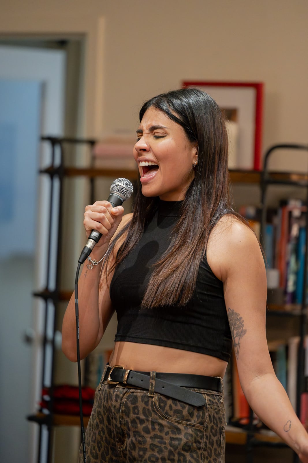 Adult vocalist at the microphone in the studio at 33 West Street in Downtown Crossing